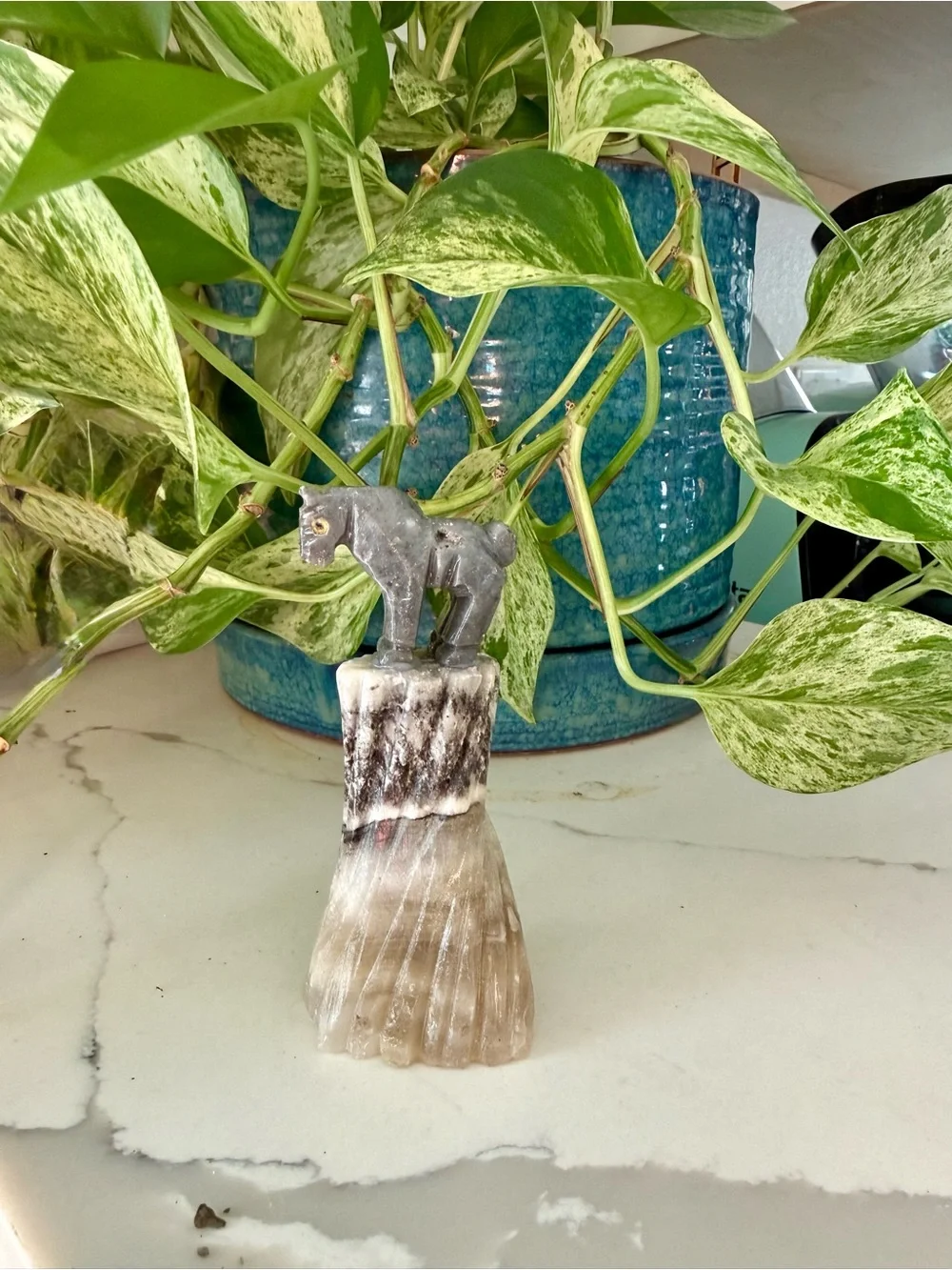 Horse figurine on Calcite